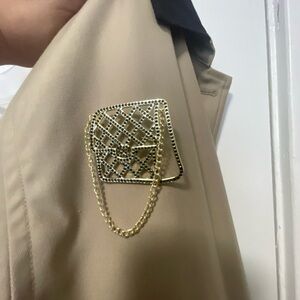 Gold flap purse brooch